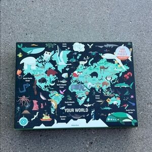 1000 piece “Your World” jigsaw puzzle.